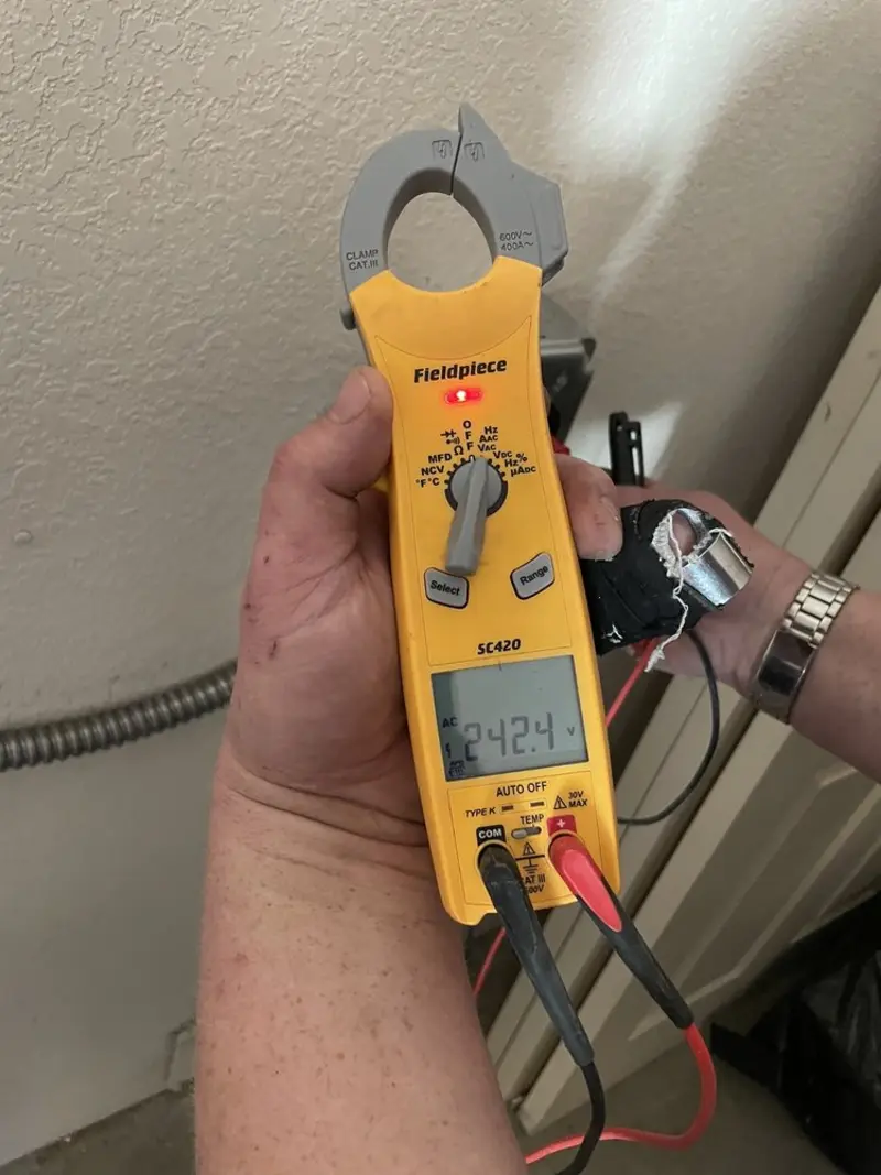 Voltage testing with clamp meter during Generator Installation in Posen